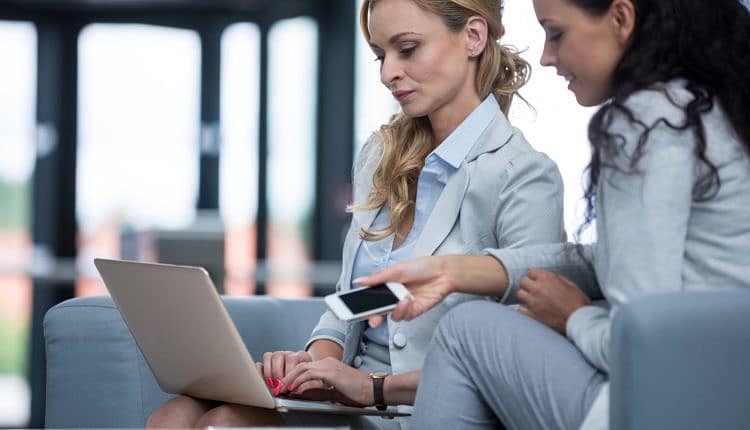 Businesswomen using laptop