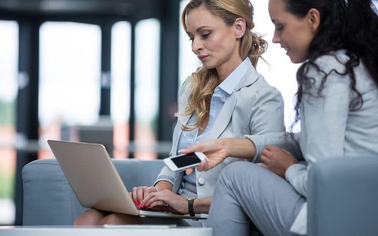 Businesswomen using laptop