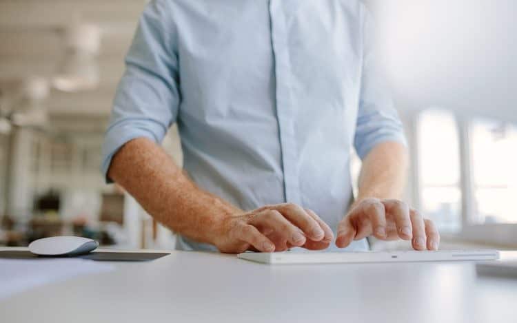 Businessman hands typing on computer keyboard