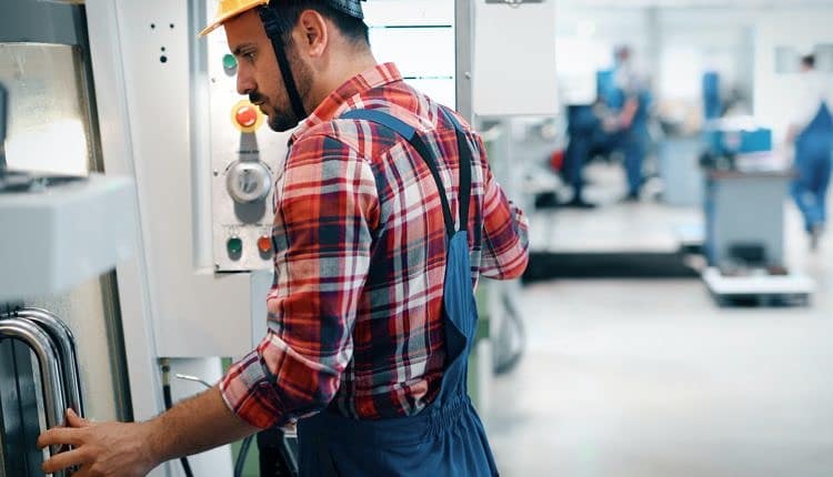 industrial factory employee working in metal manufacturing industry