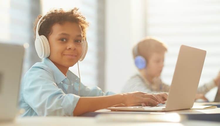 Boy In Headphones At School