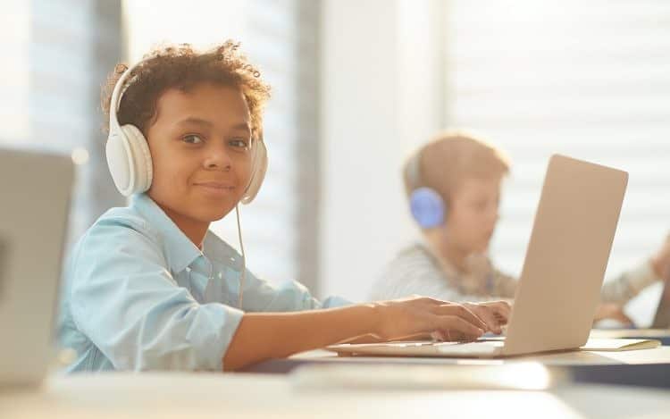 Boy In Headphones At School