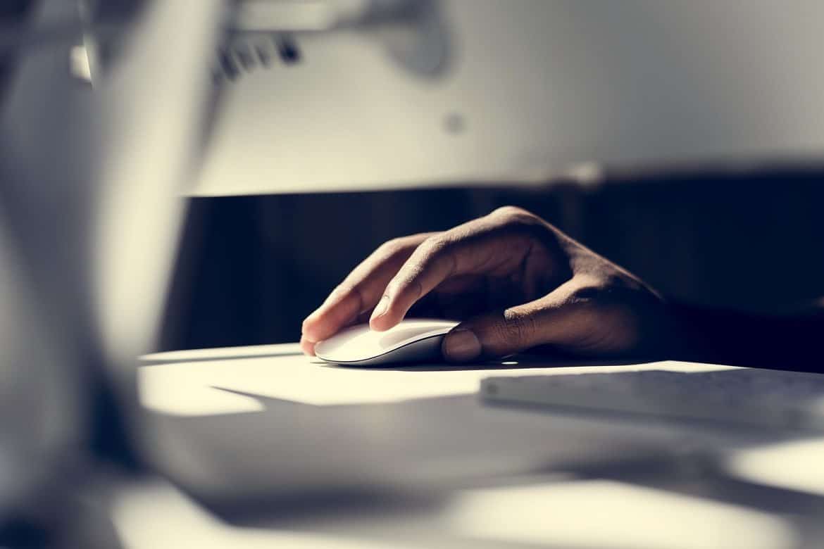 Close up of hand using a computer