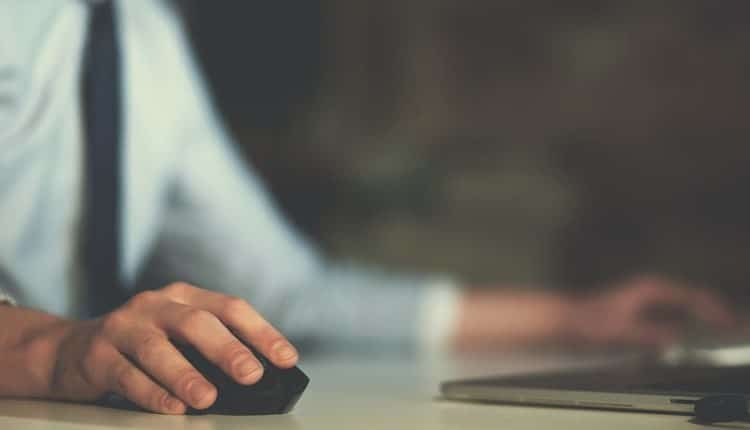 Hand using computer mouse closeup