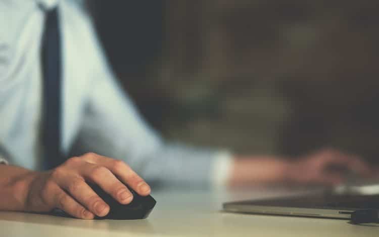 Hand using computer mouse closeup