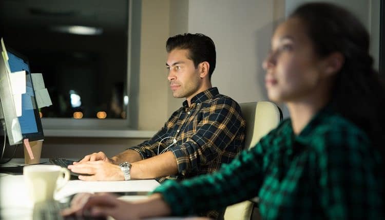 People Using Computers in Office