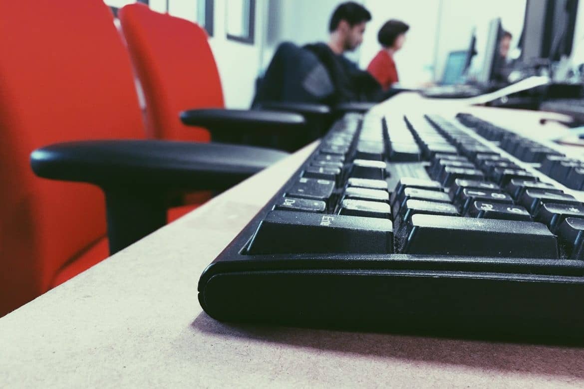 Young kids doing computer in school computer lab