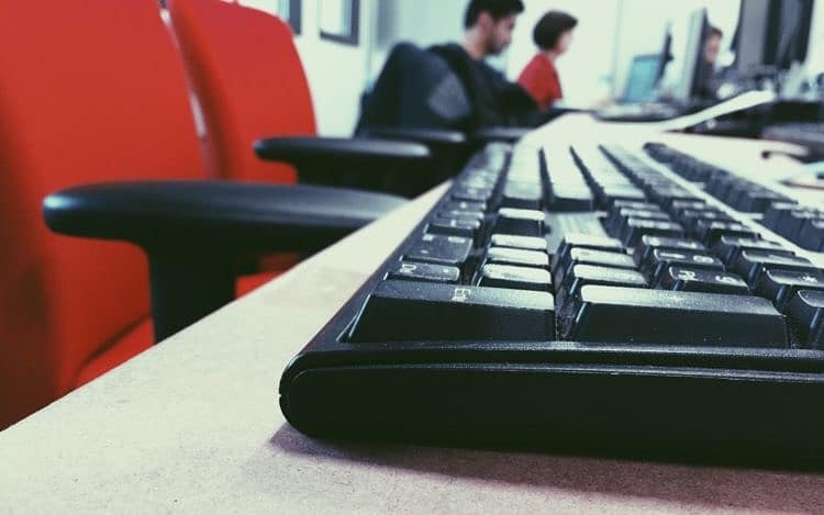 Young kids doing computer in school computer lab