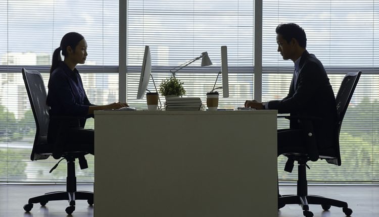 Business people working on computers in office