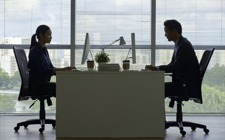 Business people working on computers in office