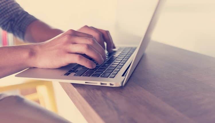 close up of male hands while working in modern office