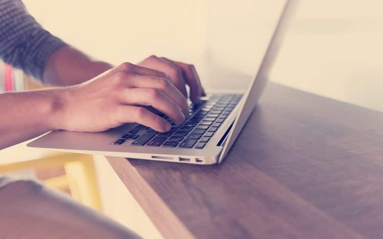 close up of male hands while working in modern office