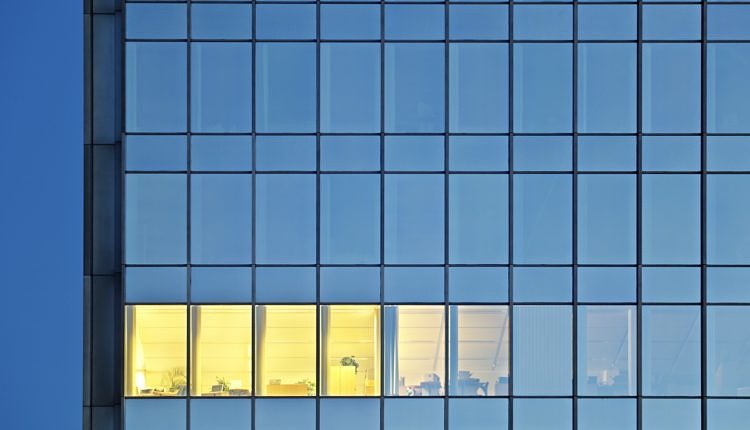 Lonely Illuminated Room In An Office Tower