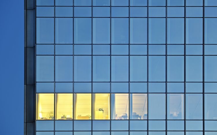 Lonely Illuminated Room In An Office Tower