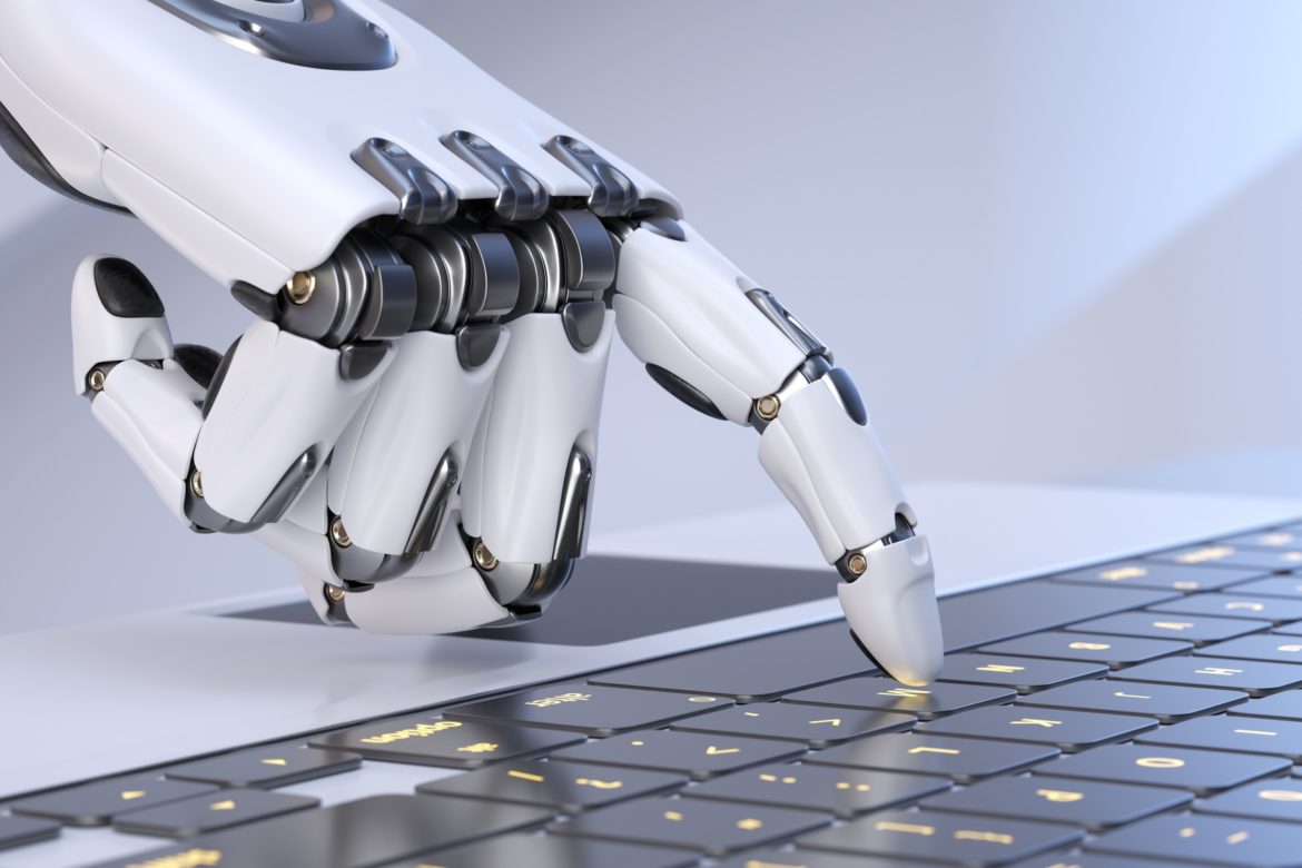 White robot cyborg hand pressing a keyboard on a laptop