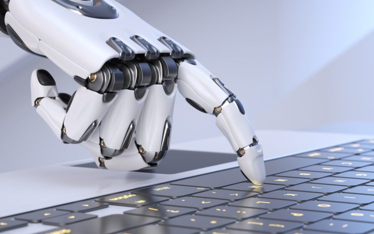 White robot cyborg hand pressing a keyboard on a laptop
