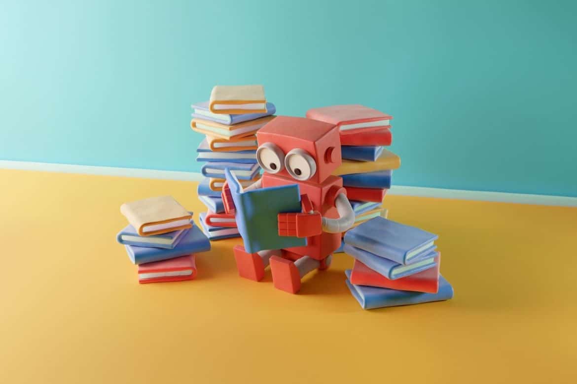 Clay robot reading a book