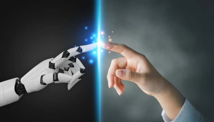 Robot and human hands pointing to each other.