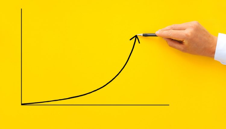 Businessman pointing arrow graph with pen. Business development to success, profit and growing growt