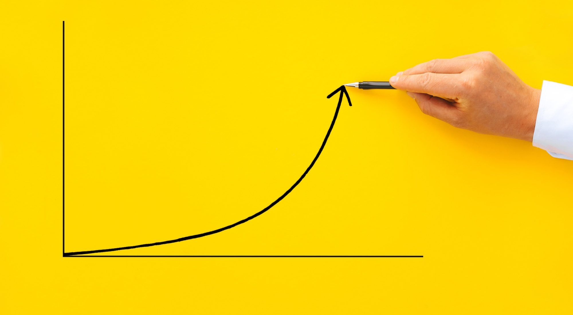 Businessman pointing arrow graph with pen. Business development to success, profit and growing growt