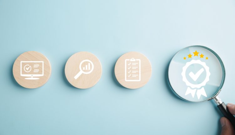 Certification and ISO quality concept illustrated with a magnifying glass highlighting