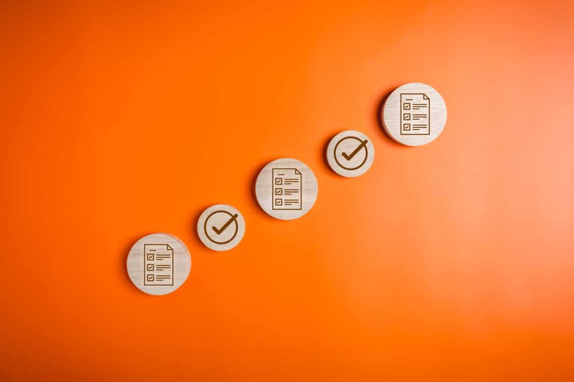 Checklist icons and magnifying glass for digital business document management