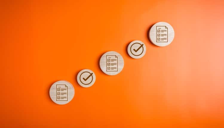 Checklist icons and magnifying glass for digital business document management