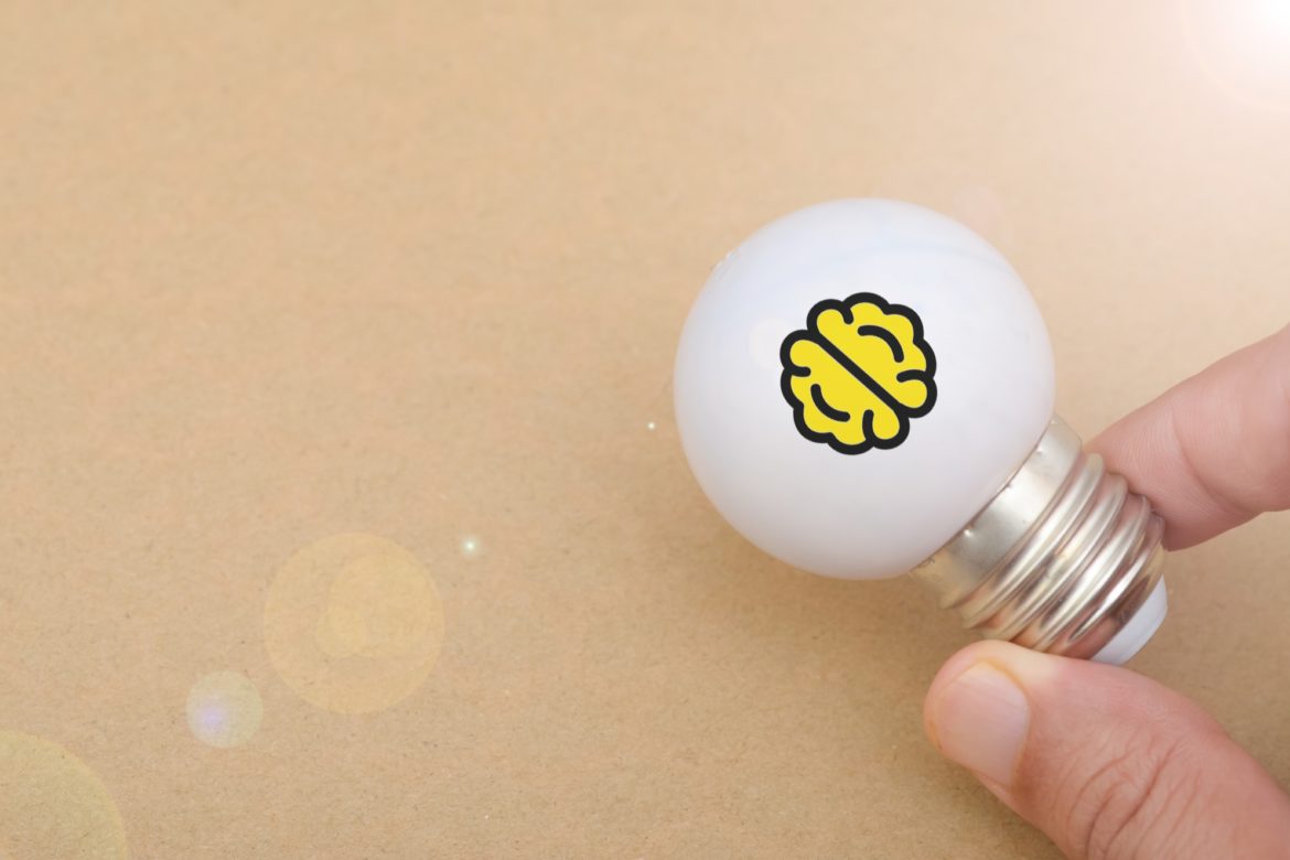 Symbol of Knowledge and Innovation: Brain Printed Inside Glowing Light Bulb