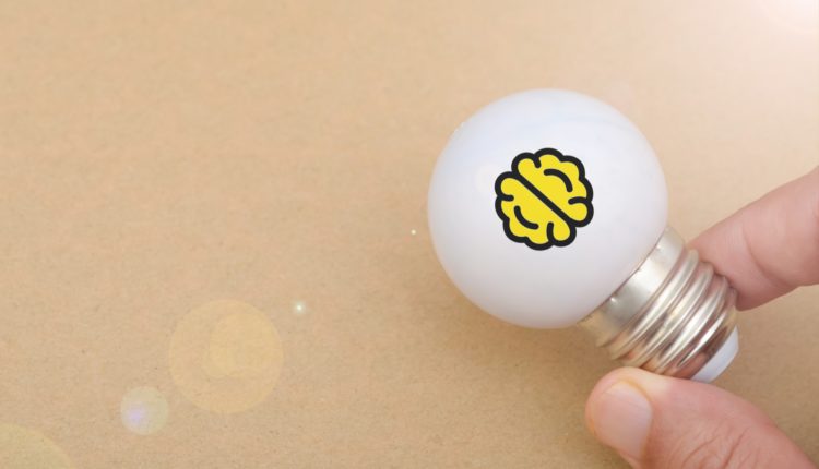 Symbol of Knowledge and Innovation: Brain Printed Inside Glowing Light Bulb