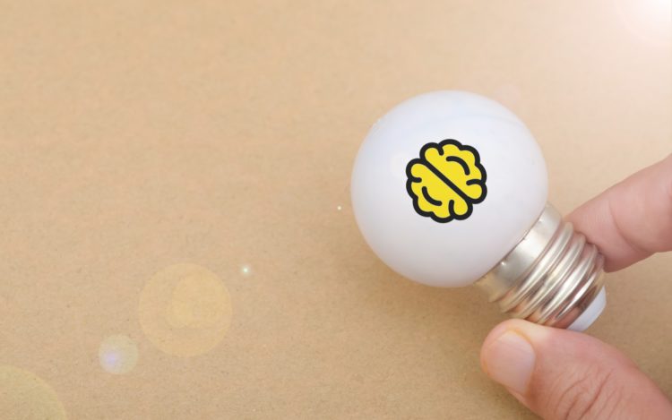 Symbol of Knowledge and Innovation: Brain Printed Inside Glowing Light Bulb