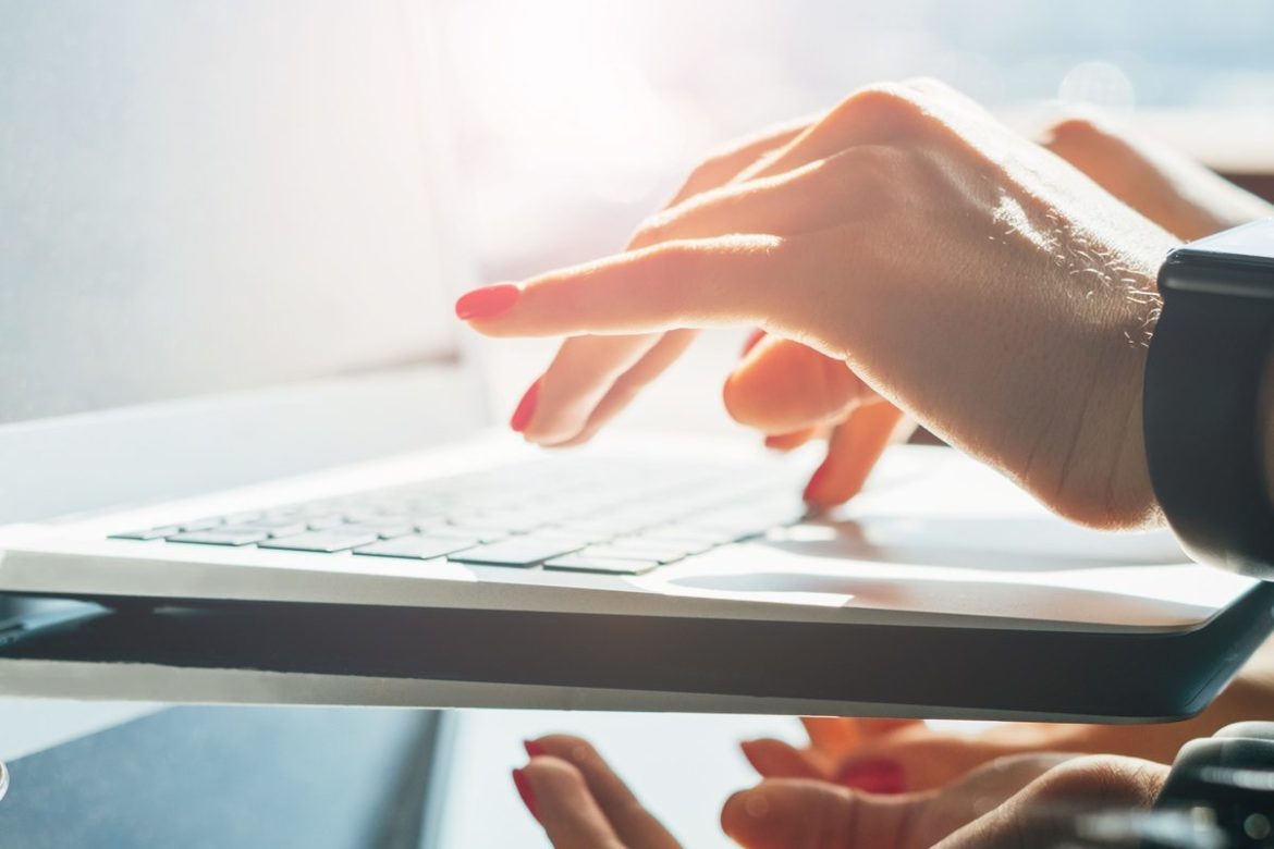 Woman hands using laptop in the office