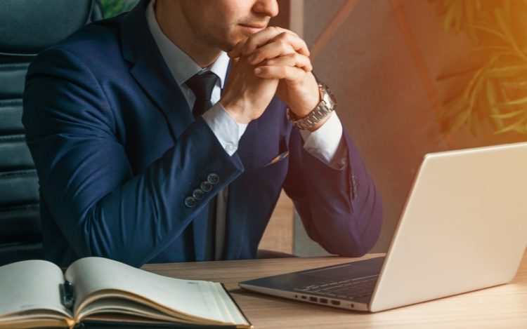 Businessman working with laptop in modern office. General manager,ceo. Young handsome confident man