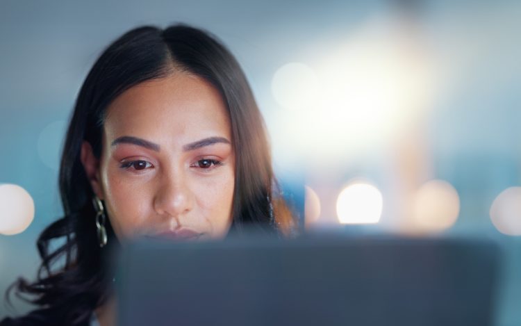 Computer, reading and business woman in the office doing research for legal corporate project. Tech
