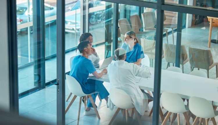 Theres so much to learn. Shot of a group of doctors in a meeting at a hospital.