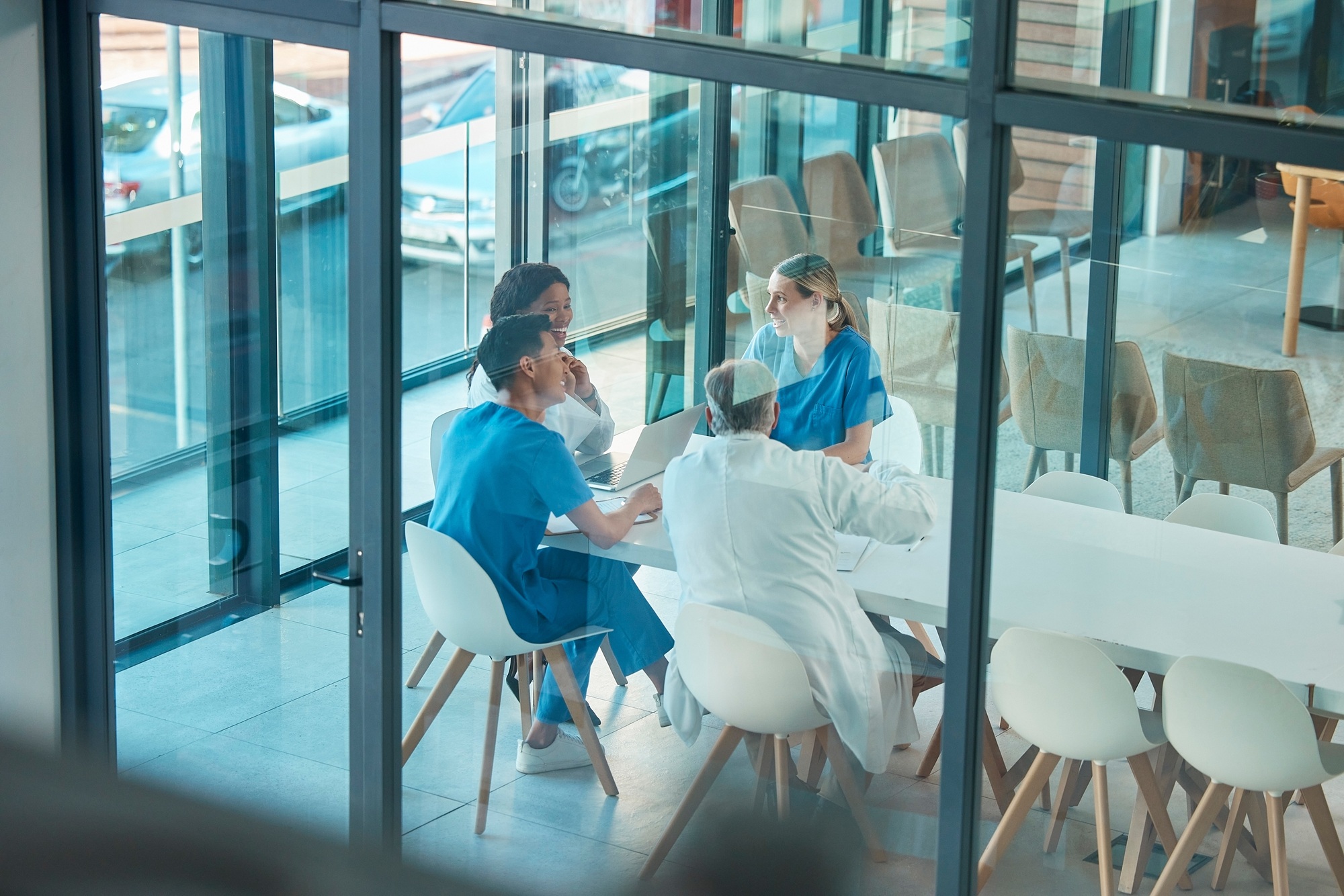 Theres so much to learn. Shot of a group of doctors in a meeting at a hospital.