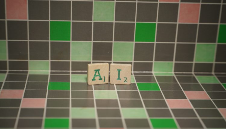 Tile with green ai text on a blocked background